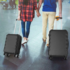 View of a traveling couple carrying the 20-inch case and the 24-inch case by the trolley handle at the airport